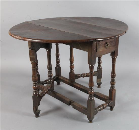 An early 18th century yew wood gateleg table, W.3ft 1in. D.3ft 5in. H.2ft 4in.